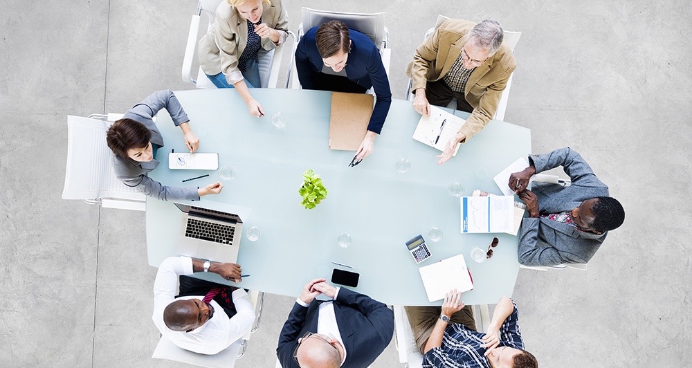 Group Of Business People Meeting at Conference Table